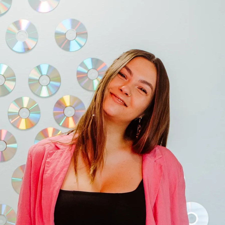 Bridgette in front of a mirrored disco wall